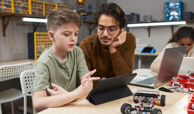 Boy controlling the robot from a tablet pc